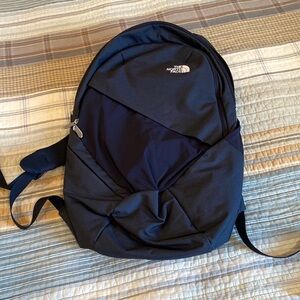 The north face black slim backpack